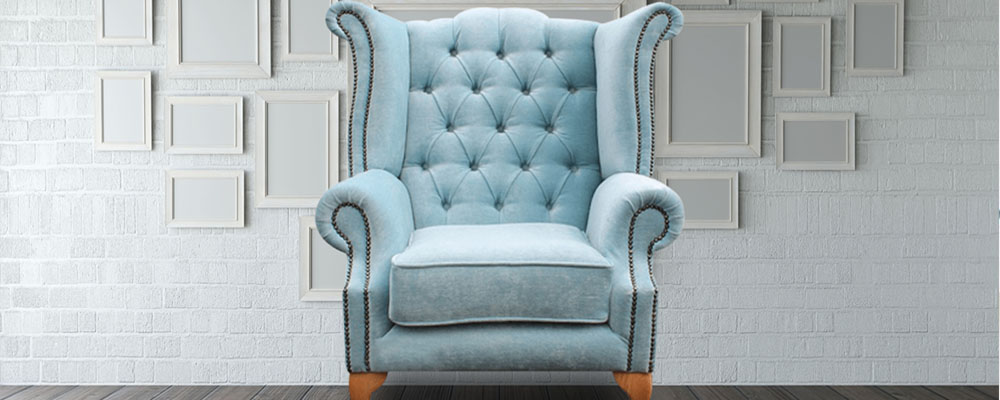 Classic wing chair with high backrest and elegant upholstery